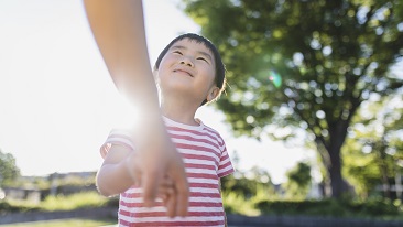  A boy looking up at someone