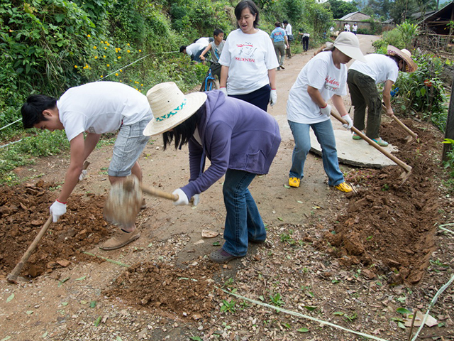 A group of volunteers gardening