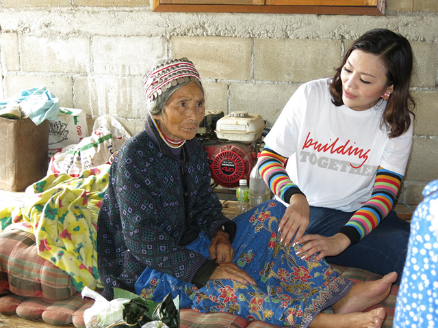 A volunteers massaging a local’s leg