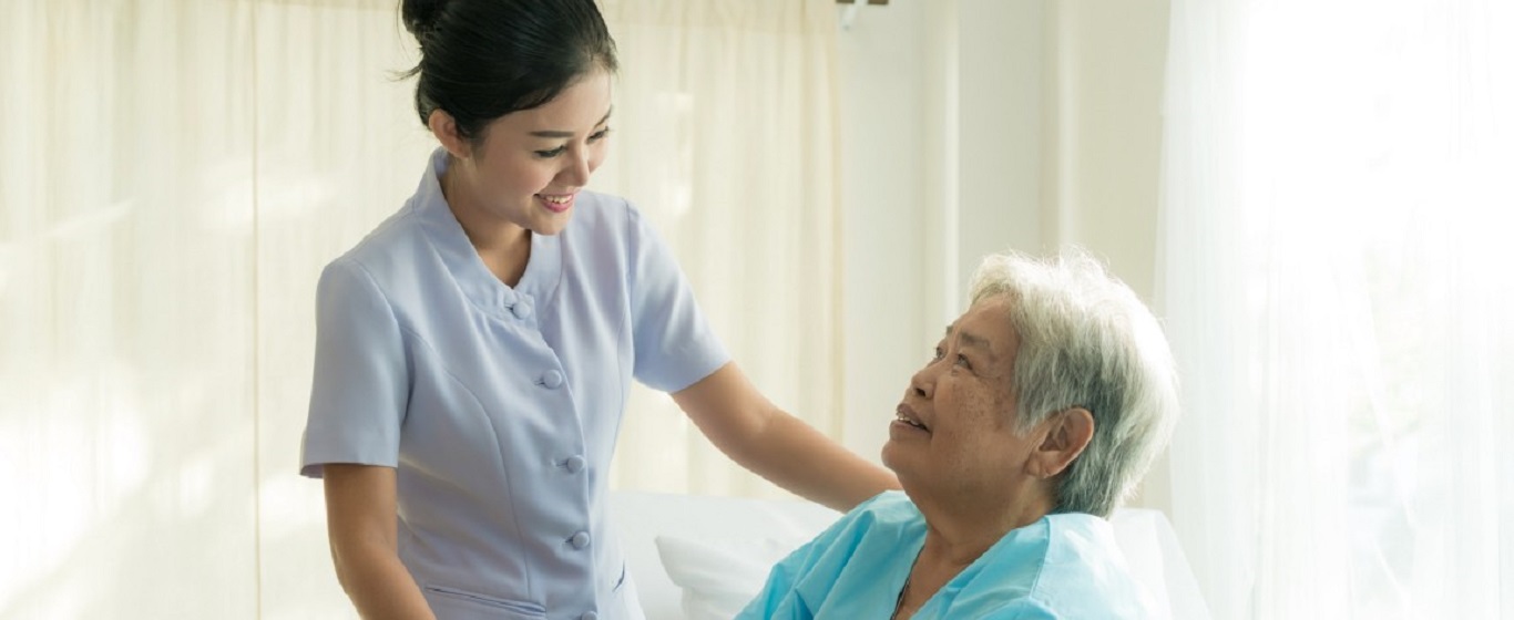 A nurse taking care of an elderly