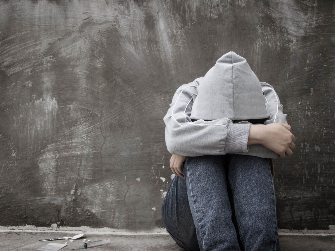 A man sitting on the floor 