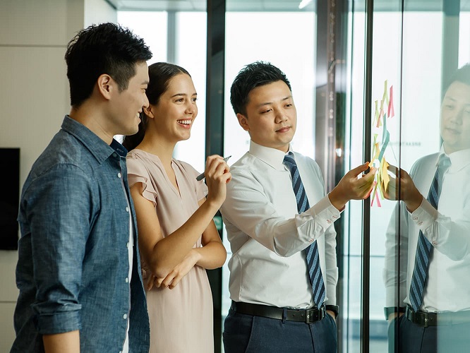 Five persons in a meeting