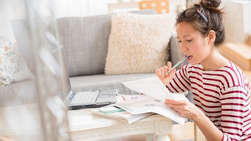 A lady looking at documents